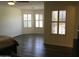 Spacious main bedroom with abundant natural light from multiple windows at 10489 S 182Nd Dr, Goodyear, AZ 85338