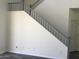 Spacious staircase with white walls and gray accents, offering a bright and airy feel at 10489 S 182Nd Dr, Goodyear, AZ 85338