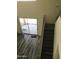 View from above of the gray wood-look stairs and railing, leading to the upper level at 10489 S 182Nd Dr, Goodyear, AZ 85338