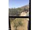 Picture window overlooking a scenic desert landscape in a quiet residential neighborhood at 10489 S 182Nd Dr, Goodyear, AZ 85338