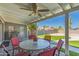 Comfortable covered back patio with chairs and outdoor furniture in landscaped backyard at 1060 S Florence Dr, Mesa, AZ 85208