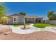 Attractive home with a well-maintained backyard, covered patio and desert landscaping at 1060 S Florence Dr, Mesa, AZ 85208