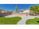 Beautiful backyard showcasing a desert landscape, artificial turf, and block wall at 1060 S Florence Dr, Mesa, AZ 85208