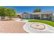 Charming home with a manicured backyard featuring a covered patio and desert landscaping at 1060 S Florence Dr, Mesa, AZ 85208