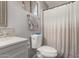 Full bathroom featuring a modern toilet, shower with curtain, and neutral color scheme at 1060 S Florence Dr, Mesa, AZ 85208