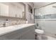Bright bathroom featuring a walk-in shower with white subway tile, a gray vanity, and modern fixtures at 1060 S Florence Dr, Mesa, AZ 85208