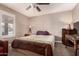 Neutral bedroom with a window providing natural light and a bed with cozy bedding at 1060 S Florence Dr, Mesa, AZ 85208