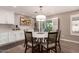Dining area featuring hardwood floors, a modern chandelier, and access to the backyard at 1060 S Florence Dr, Mesa, AZ 85208