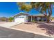 Inviting single-story home showcasing a well-maintained front yard and a covered porch at 1060 S Florence Dr, Mesa, AZ 85208