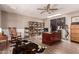 Home office featuring wood floors, a large desk, built-in shelving, and plenty of natural light at 1060 S Florence Dr, Mesa, AZ 85208