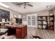 Bright home office with wood floors, wainscoting, and double French doors leading to the exterior at 1060 S Florence Dr, Mesa, AZ 85208
