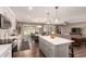 Modern kitchen with white cabinetry, stainless steel appliances, a kitchen island, and hardwood floors at 1060 S Florence Dr, Mesa, AZ 85208