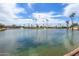 Scenic view of the community pond with water features on a sunny day at 1060 S Florence Dr, Mesa, AZ 85208