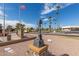 Veteran's Memorial statue with golf carts and other community features in the background at 1060 S Florence Dr, Mesa, AZ 85208