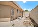 A fully-fenced backyard with concrete patio area, desert landscaping, and exterior seating, ensuring a private retreat at 10601 W Hutton Dr, Sun City, AZ 85351