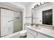 All-white bathroom with shower and sink at 10601 W Hutton Dr, Sun City, AZ 85351