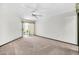 Carpeted bedroom with sliding doors to a patio at 10601 W Hutton Dr, Sun City, AZ 85351