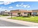 Charming home with attached garage, beautiful lawn and shrubbery and tiled roof at 10601 W Hutton Dr, Sun City, AZ 85351