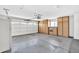 Spacious garage featuring built-in cabinets, an automatic door opener, and ample storage space for tools and vehicles at 10601 W Hutton Dr, Sun City, AZ 85351