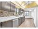 Well-equipped kitchen with modern appliances, stylish backsplash, and ample counter space for culinary creations at 10601 W Hutton Dr, Sun City, AZ 85351