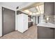Spacious kitchen featuring tile floors, white appliances, and ample counter space for cooking and entertaining at 10601 W Hutton Dr, Sun City, AZ 85351