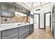 Well-lit kitchen features tile backsplash, ceramic tile floors, and access to additional rooms at 10601 W Hutton Dr, Sun City, AZ 85351
