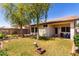 Spacious backyard with lawn and mature trees, perfect for outdoor living at 11591 W Jefferson St, Avondale, AZ 85323