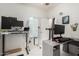 Office featuring dual monitors, a whiteboard, and modern decor at 11591 W Jefferson St, Avondale, AZ 85323