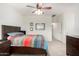 Bright main bedroom with tiled floor, ceiling fan, and neutral walls at 11591 W Jefferson St, Avondale, AZ 85323