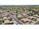High aerial of a landscaped desert community with tile roofs and mature trees at 1182 E Canyon Way, Chandler, AZ 85249