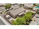 An aerial view of the backyard, showing a covered patio and landscaped areas at 1182 E Canyon Way, Chandler, AZ 85249