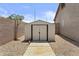 View of backyard storage shed with a concrete path at 1182 E Canyon Way, Chandler, AZ 85249