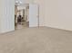 Bedroom with neutral carpet and view into formal dining room at 1182 E Canyon Way, Chandler, AZ 85249