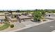 Expansive home features a 3 car garage, desert landscaping, and solar panels for energy efficiency at 1182 E Canyon Way, Chandler, AZ 85249