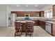 Spacious kitchen boasting stainless steel appliances, granite counters, and a large island at 1182 E Canyon Way, Chandler, AZ 85249