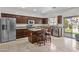 Spacious kitchen with granite countertops, stainless steel appliances, and a center island with seating at 1182 E Canyon Way, Chandler, AZ 85249