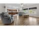 Open-concept living room featuring hardwood floors, large windows, and comfortable seating area at 1182 E Canyon Way, Chandler, AZ 85249