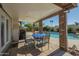 Relaxing covered back patio perfect for dining near a refreshing pool at 12154 S Ki Rd, Phoenix, AZ 85044