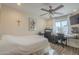Cozy bedroom featuring a ceiling fan, bright windows and a comfy bed at 12154 S Ki Rd, Phoenix, AZ 85044