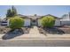 Inviting single-story home with a secure gated entrance and well-manicured landscaping at 12154 S Ki Rd, Phoenix, AZ 85044
