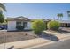 Lovely single-story home with desert landscaping, mature bushes and shade trees at 12154 S Ki Rd, Phoenix, AZ 85044
