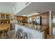 Kitchen boasts updated countertops, stainless steel appliances, and a breakfast bar, great for meal preparation and casual dining at 12154 S Ki Rd, Phoenix, AZ 85044