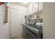 Functional laundry room featuring modern washer and dryer and storage at 12154 S Ki Rd, Phoenix, AZ 85044