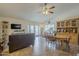 Large living room with a ceiling fan, and an adjacent dining area, perfect for entertaining guests at 12154 S Ki Rd, Phoenix, AZ 85044