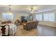 Open-concept living room with lots of space for dining and entertaining with tile floors at 12154 S Ki Rd, Phoenix, AZ 85044