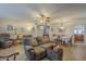 Inviting living area features a comfortable sofa and open dining space with great natural light and a ceiling fan at 12154 S Ki Rd, Phoenix, AZ 85044