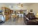 Open-concept living space with a dining area, a glimpse of the kitchen, and comfortable seating for entertaining guests at 12154 S Ki Rd, Phoenix, AZ 85044
