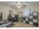 Functional office space with ample desk room, storage and a ceiling fan at 12154 S Ki Rd, Phoenix, AZ 85044