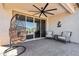 Relaxing covered patio with ceiling fan and comfortable seating at 12538 E Pivot Peak --, Gold Canyon, AZ 85118