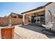 Covered backyard patio with comfortable seating and ceiling fan at 12538 E Pivot Peak --, Gold Canyon, AZ 85118